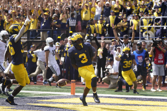 Michigan's A.J. Henning (3) celebrates his punt return for a 61-yard touchdown against Connecticut in the first half of an NCAA college football game in Ann Arbor, Mich., Saturday, Sept. 17, 2022. (AP Photo/Paul Sancya)