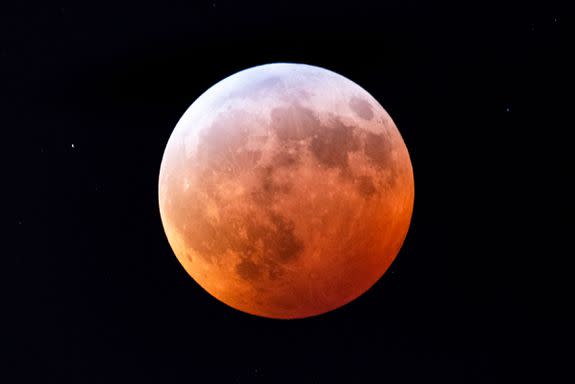 Mandatory Credit: Photo by JIM LO SCALZO/EPA-EFE/REX/Shutterstock (10069477a) The moon turns red during the so-called 'super blood wolf moon' lunar eclipse in Washington, DC, USA, 21 January 2019. Bitterly cold temperatures hovering just above zero degrees Fahrenheit did not stop DC residents from watching the only total lunar eclipse of the year. Super blood wolf moon lunar eclipse in Washington, DC, USA - 21 Jan 2019