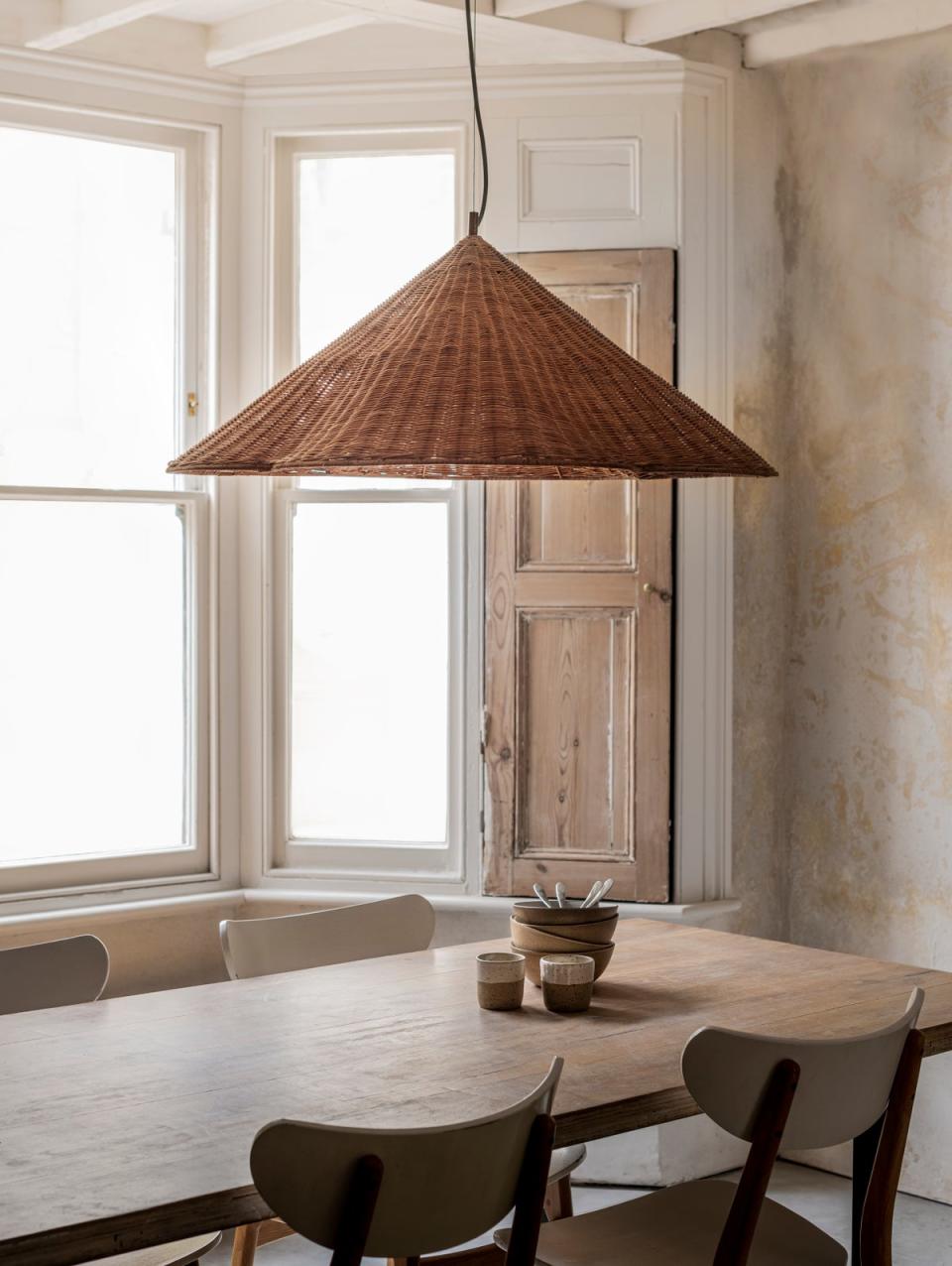 The Bardi pendent fixture perfectly combines brass, rattan and opal glass (lights&lamps)