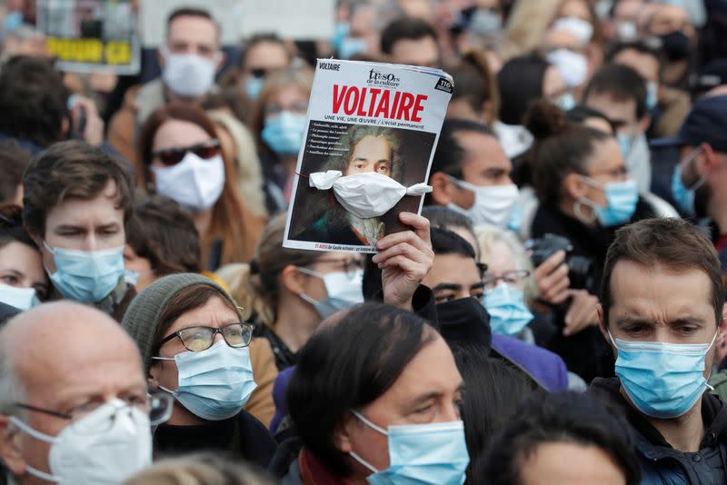 People pay tribute to beheaded teacher Samuel Paty in Paris