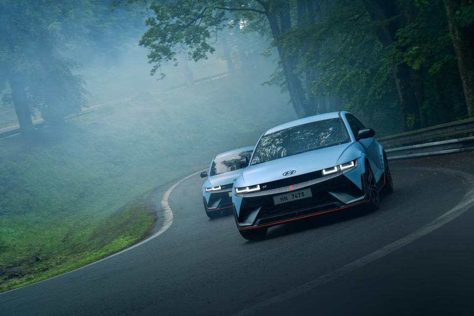 Two Hyundai Ioniq 5 Ns on a road in gloomy weather.