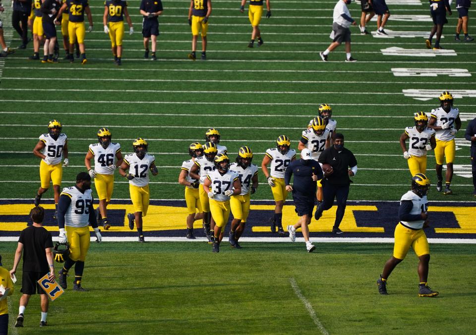 University of Michigan football players run drills on the practice field at the University of Michigan in Ann Arbor on Wednesday, September 16, 2020.