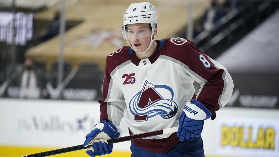 FILE - In this May 10, 2021 file photo, Colorado Avalanche defenseman Cale Makar (8) plays against the Vegas Golden Knights during the first period of an NHL hockey game in Las Vegas. The Avalanche kicked off the second day of the NHL draft by signing top defenseman Makar to a $54 million, six year contract that carries an annual salary cap hit of $9 million. (AP Photo/John Locher, File)