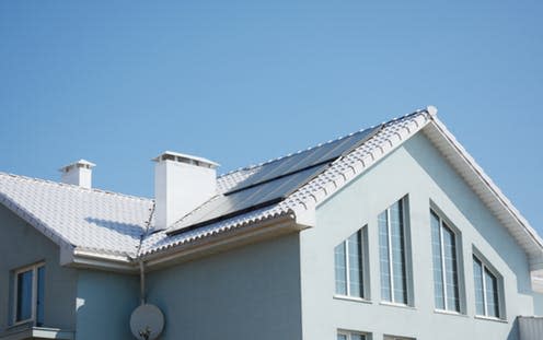 <span class="caption">A home designed to Passivhaus standards, with solar panels and windows that help conserve heat.</span> <span class="attribution"><a class="link " href="https://www.shutterstock.com/image-photo/modern-passive-house-white-roof-solar-1012291636" rel="nofollow noopener" target="_blank" data-ylk="slk:Radovan1/Shutterstock;elm:context_link;itc:0;sec:content-canvas">Radovan1/Shutterstock</a></span>