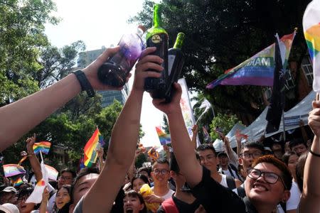 Same-sex marriage supporters celebrate after Taiwan became the first place in Asia to legalize same-sex marriage, outside the Legislative Yuan in Taipei, Taiwan May 17, 2019. REUTERS/Tyrone Siu