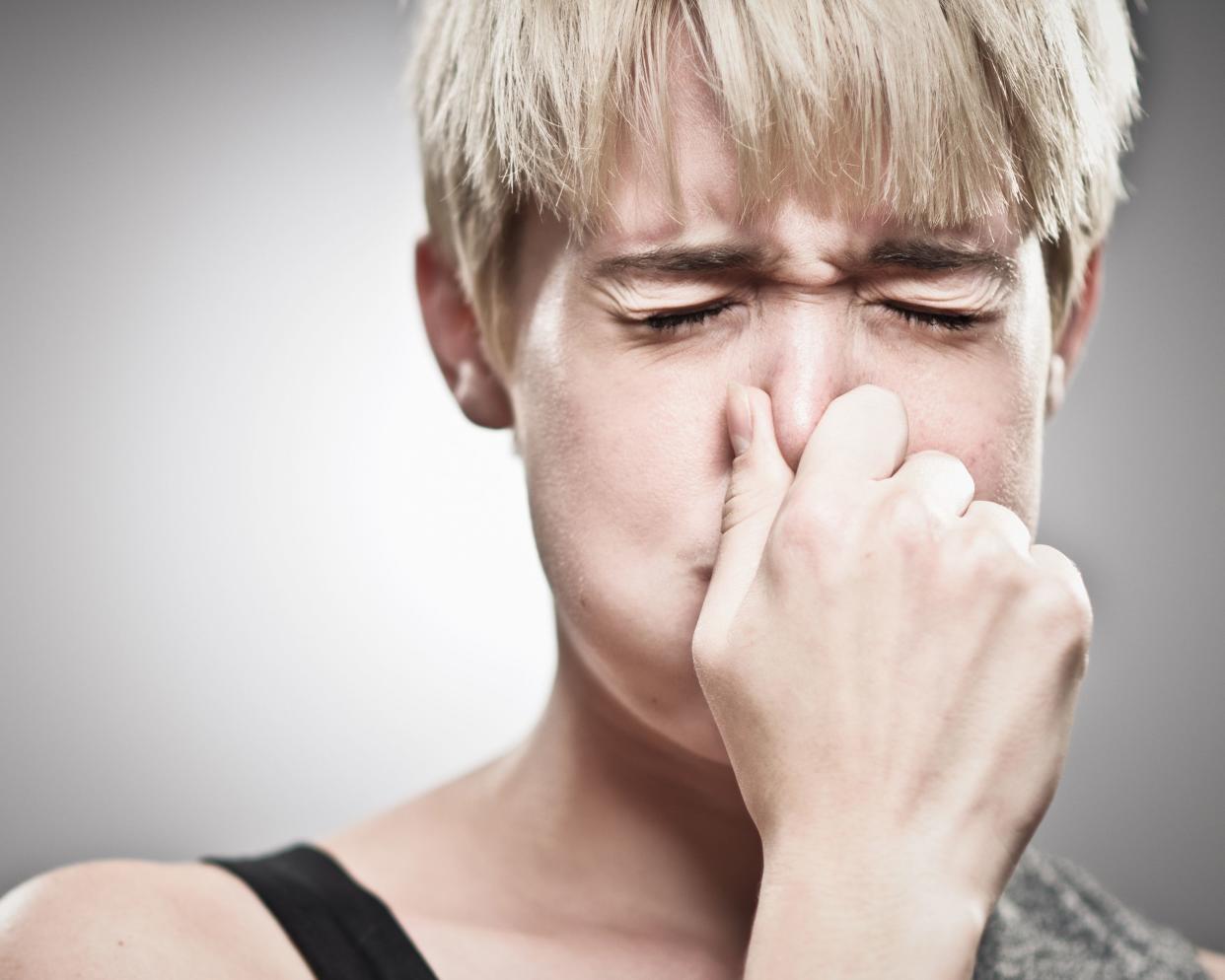 young man holding breath