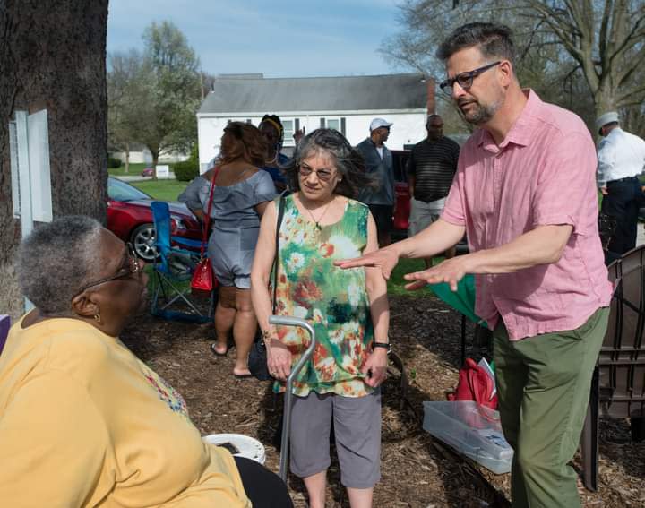 David Hassler director of the Wick Poetry Center, and Doria Daniels discuss future opportunities to have poetry reading and writing for kids and adults in the garden. The Rev. Christie Anderson of Kent Social Services listens to the conversation.