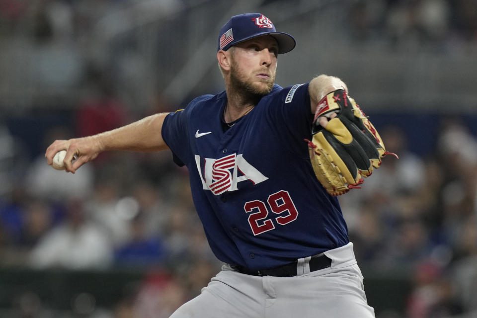 U.S. pitcher Merrill Kelly (29) aims a pitch during the first inning of a World Baseball Classic final game against Japan, Tuesday, March 21, 2023, in Miami. (AP Photo/Marta Lavandier)