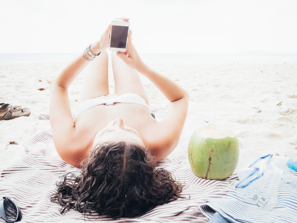 Young Woman Browsing The Net During Vacations.