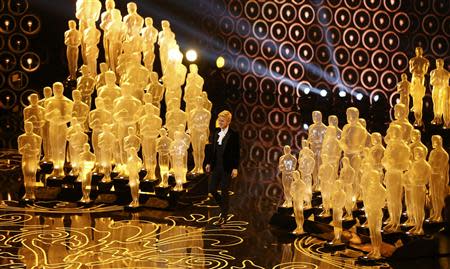 Ellen Degeneres takes the stage to host the show at the start of the 86th Academy Awards in Hollywood, California March 2, 2014. REUTERS/Lucy Nicholson