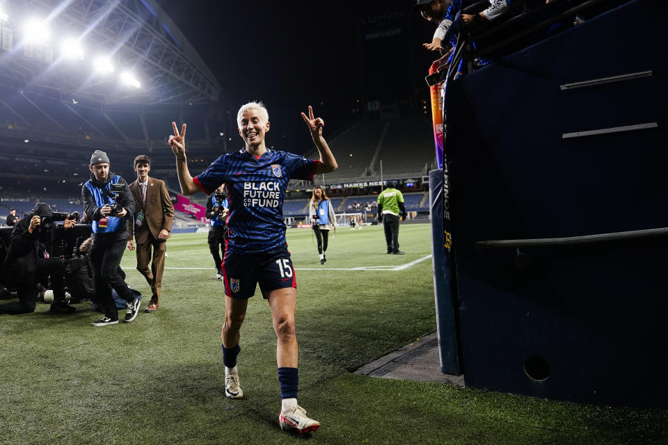 OL Reign forward Megan Rapinoe gestures to photographers as she walks back to the locker room following a 1-0 win against Angel City FC in an NWSL quarterfinal playoff soccer match Friday, Oct. 20, 2023, in Seattle. (AP Photo/Lindsey Wasson)