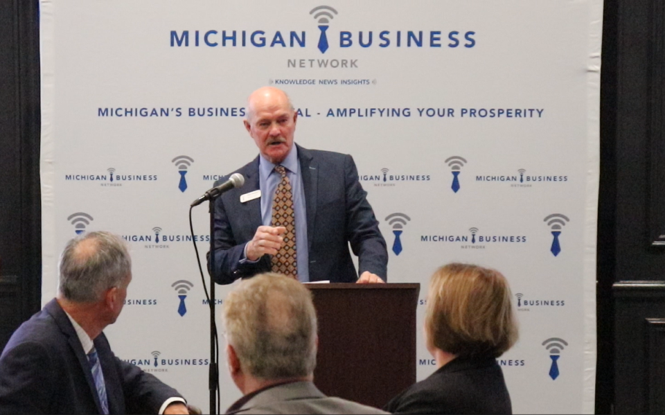 Michigan Business Network CEO Chris Holman speaks Jan. 11 at Friendship Hall, Capital Region International Airport, during the Michigan Business Network's 2023 Economic Forecast breakfast.