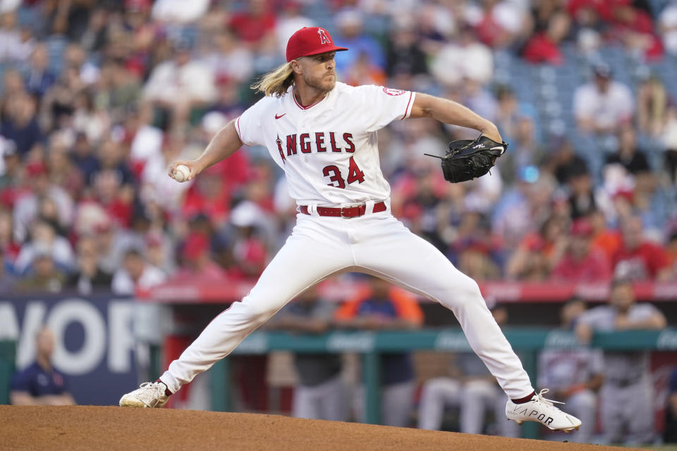 Los Angeles Angels starting pitcher Noah Syndergaard (34) throws during the first inning of a baseball game against the Houston Astros in Anaheim, Calif., Saturday, April 9, 2022. (AP Photo/Ashley Landis)