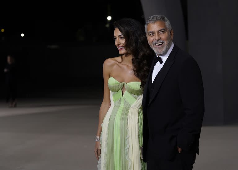 Amal and George Clooney at the party where their friend Julia Roberts was one of the honorees
