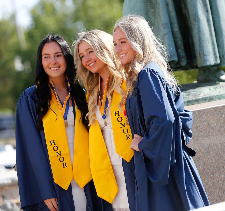 Aislinn Kelley, of Weymouth, Alana Sullivan, of Hanover and Megan Siegfried, of Weymouth, at the Archbishop Williams High School commencement on Thursday, May 26, 2022.