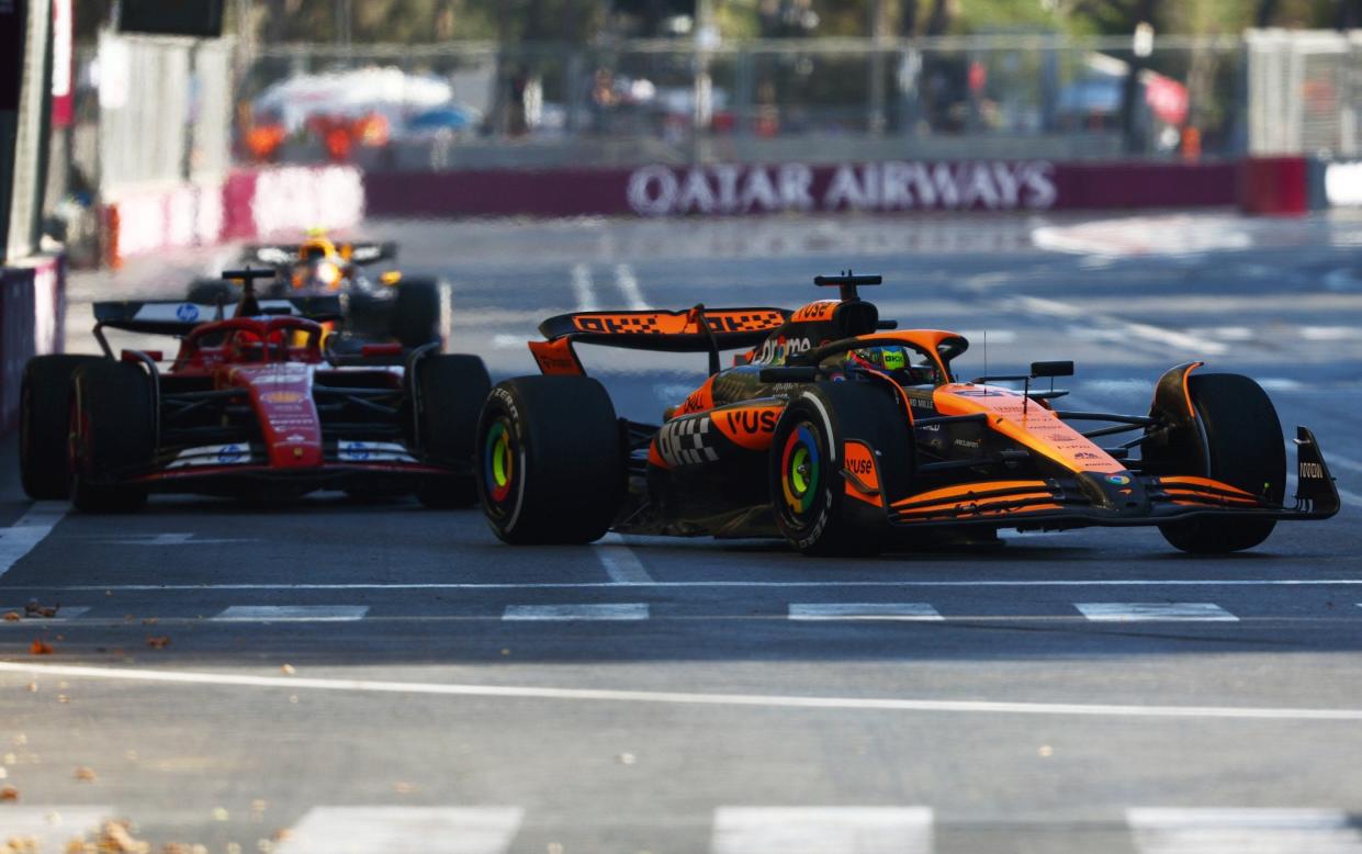 Oscar Piastri of Australia driving the (81) McLaren MCL38 Mercedes leads Charles Leclerc of Monaco driving the (16) Ferrari SF-24 during the F1 Grand Prix of Azerbaijan at Baku City Circuit on September 15, 2024 in Baku, Azerbaijan