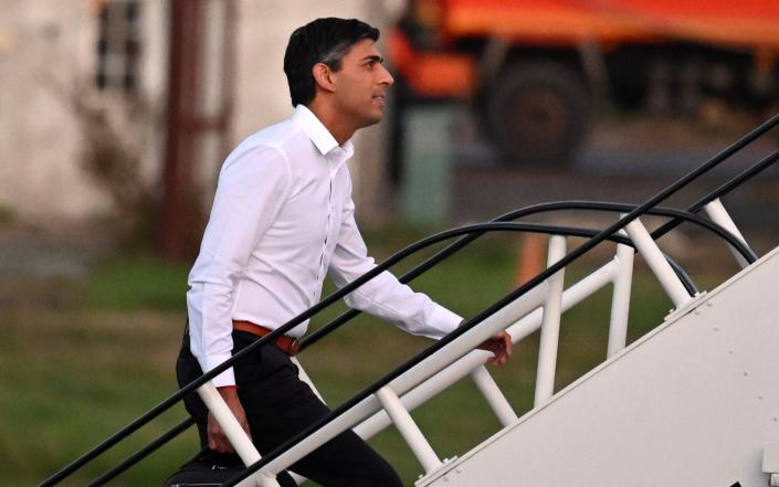 Rishi Sunak boards a plane at Stansted Airport on Sunday, as he travels to the G20 summit in Bali - Leon Neal/Getty Images