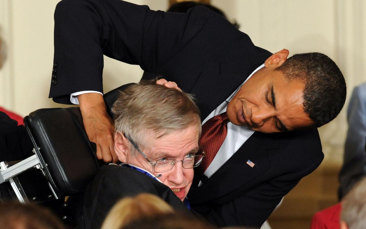 Stephen Hawking receives the Presidential Medal of Freedom from US President Barack Obama - AFP