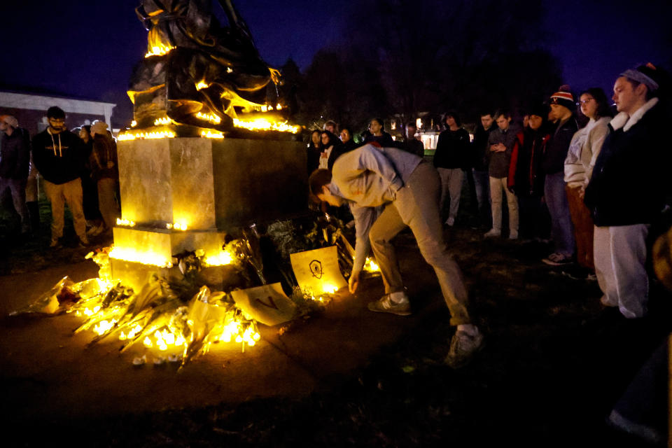 Students and community members gather for a candlelight vigil after a shooting that left three students dead the night before at the University of Virginia, Monday, Nov. 14, 2022, in Charlottesville, Va. (Shaban Athuman/Richmond Times-Dispatch via AP)