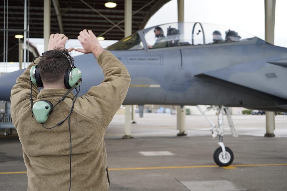 Chief of the National Guard Bureau, Gen. Daniel Hokanson, sits in the back of an F-15D Eagle as 142nd Wing pilot, Col. Michael Kosderka, prepares to taxi, March 19, 2022, Portland Air National Guard Base, Ore. During his visit to the base, Hokanson had a chance to see the 142nd Wing's flying mission first-hand, while discussing challenges and the benefits the anticipated F-15 EX will bring to the fight. (U.S. Air National Guard photo by Master Sgt. Steven Conklin)