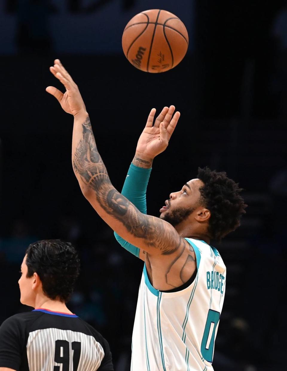 Charlotte Hornets forward Miles Bridges checks the grip and rotation of the basketball prior to action against the Dallas Mavericks on Thursday, October 13, 2021 at Spectrum Center in Charlotte, NC.