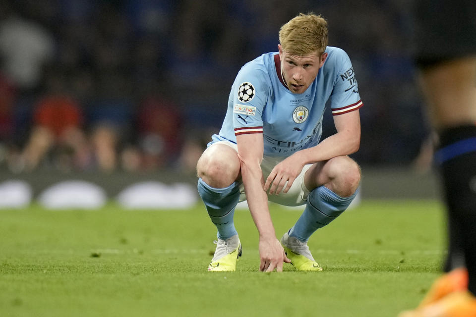 Manchester City's Kevin De Bruyne crouches on the pitch after getting injured during the Champions League final soccer match between Manchester City and Inter Milan at the Ataturk Olympic Stadium in Istanbul, Turkey, Saturday, June 10, 2023. (AP Photo/Francisco Seco)