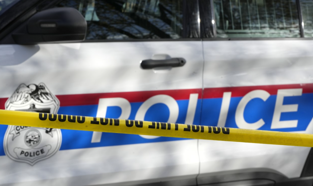 Columbus police use yellow tape to cordon off a crime scene.