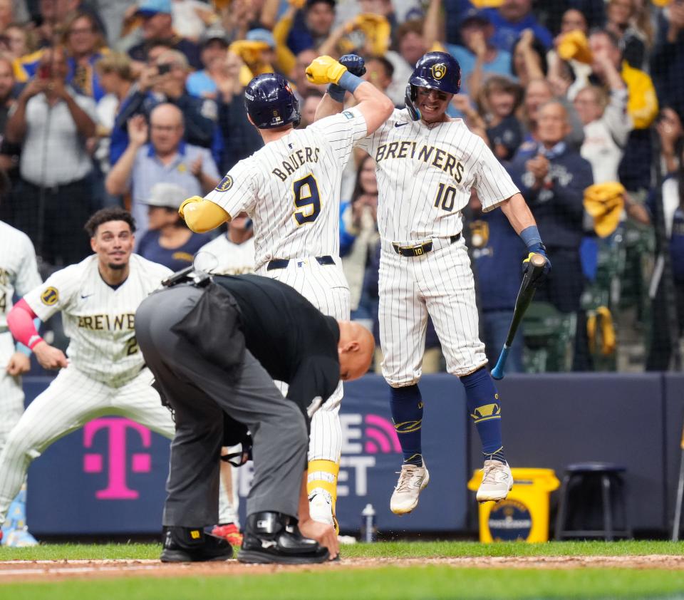 Brewers rightfielder Sal Frelick celebrates with first baseman Jake Bauers after Bauers' solo home run in the seventh inning Thursday. Frelick followed it with a home run of his own for a 2-0 Brewers lead.