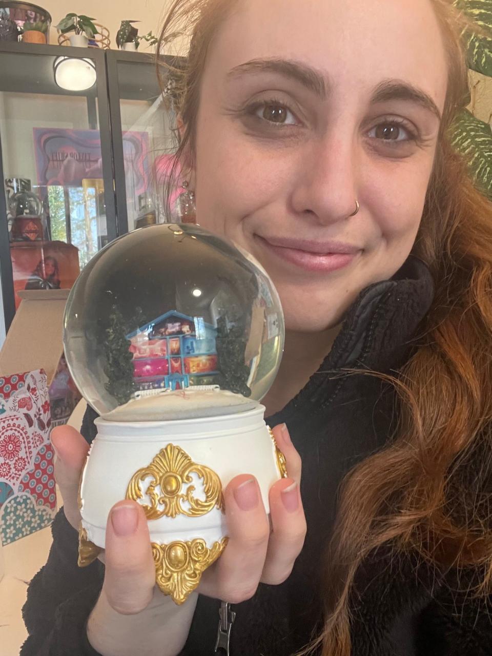 Madeline Cooperman with her Taylor Swift "Lover" snow globe.