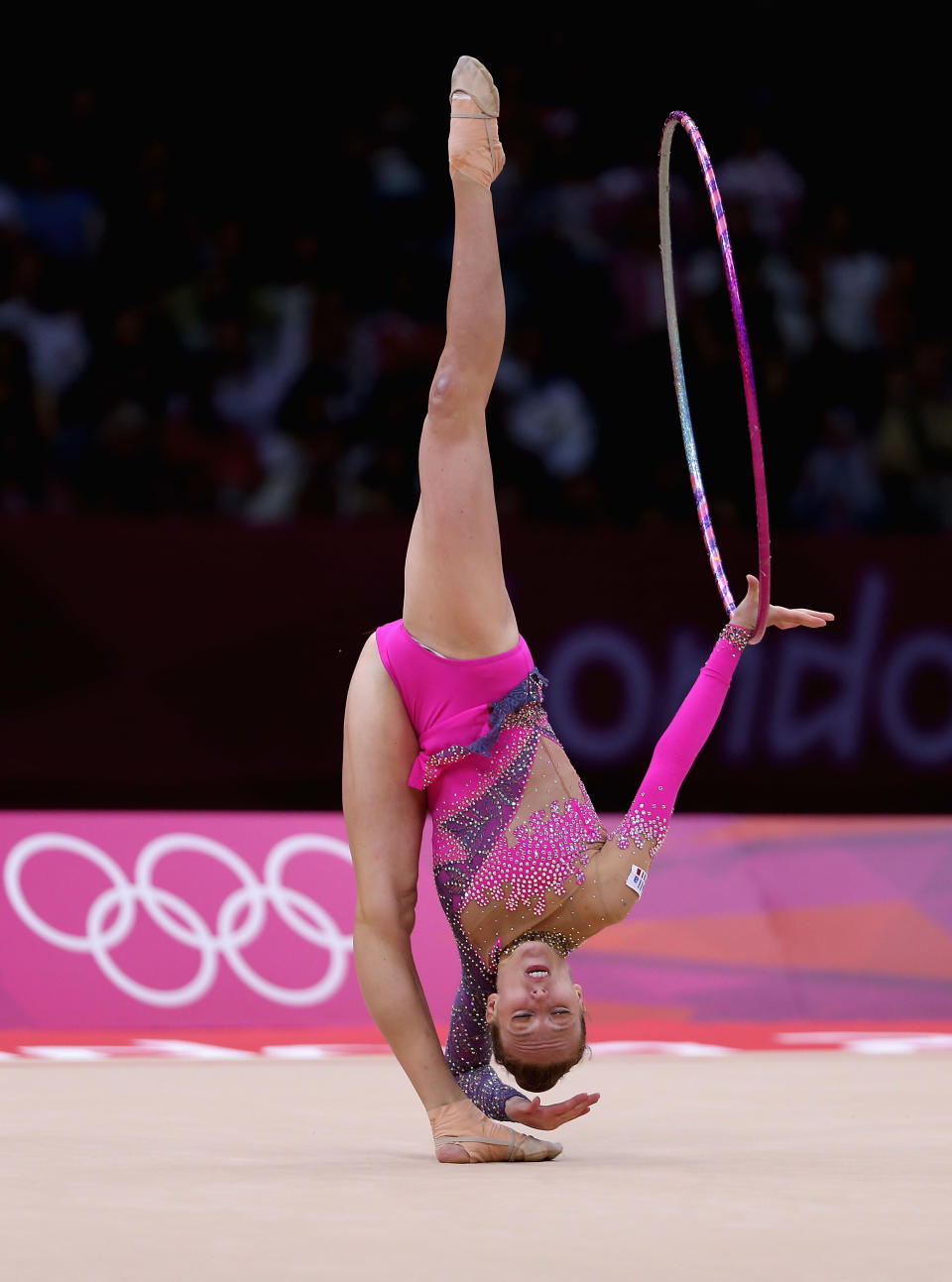 LONDON, ENGLAND - AUGUST 09: Julieta Cantaluppi of Italy performs with the hoop during the Rhythmic Gymnastics qualification on Day 13 of the London 2012 Olympics Games at Wembley Arena on August 9, 2012 in London, England. (Photo by Julian Finney/Getty Images)