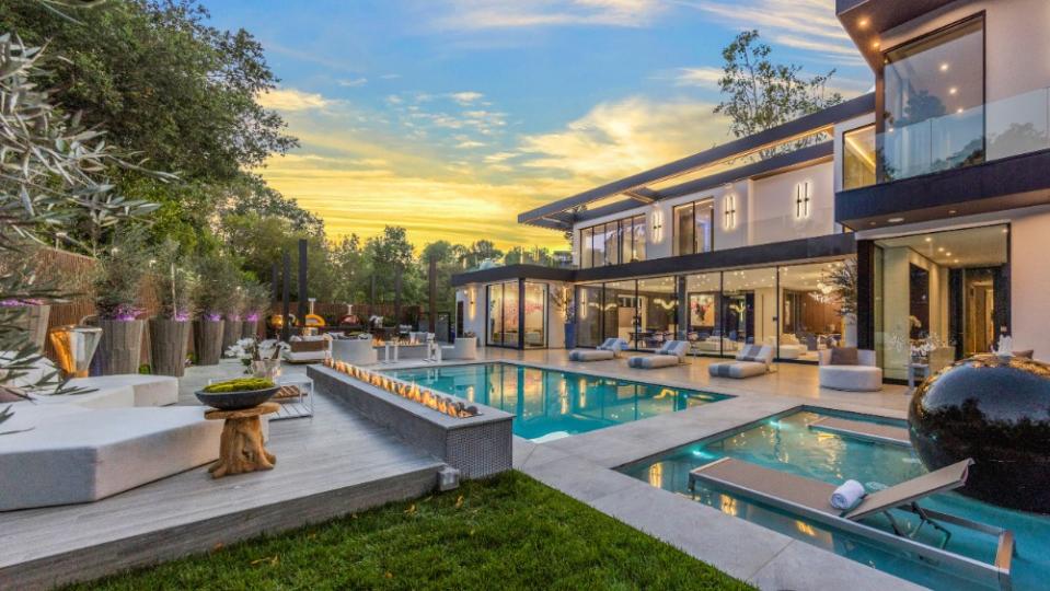 The pool area with loungers and fireplaces. - Credit: Joe Bryant