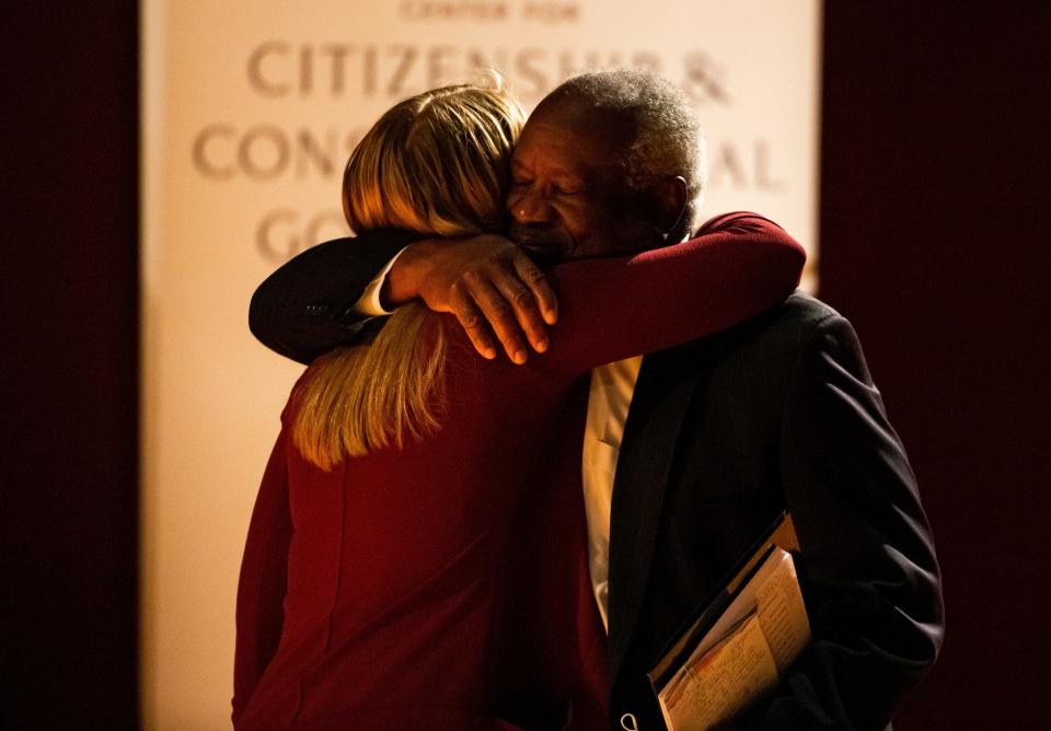 Supreme Court Justice Clarence Thomas hugs Notre Dame student Maggie Garnett, who invited him to speak on campus. Garnett's mother clerked for Thomas.