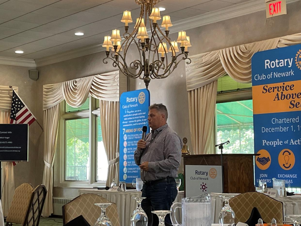 Michael "Mick" Yinger, director of First Responders' Bridge, share information about the retreat aimed at healing first responders and their families at a Newark Rotary Club meeting on Tuesday, July 19, 2022.
