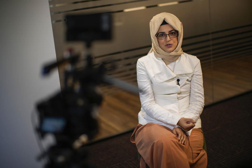 Hatice Cengiz, the fiancee of murdered Saudi journalist Jamal Kashoggi, talks during an interview with The Associated Press in Istanbul, Turkey, Thursday, July 14, 2022. Cengiz described Joe Biden's decision to visit Saudi Arabia as "heartbreaking," accusing the U.S. president on Thursday of backing down from his pledge of prioritizing human rights. (AP Photo/Francisco Seco)