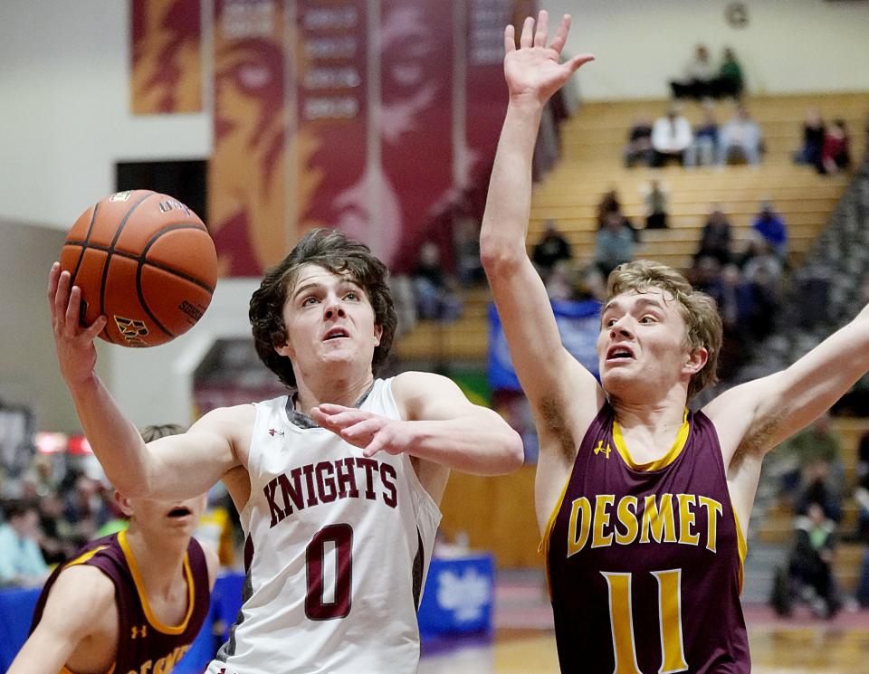 Aberdeen Christian's Andrew Brennan (0) drives against De Smet's Gannon Gruenhagen during their semifinal game in the state Class B boys basketball tournament on Friday, March 17, 2023 at the Barnett Center in Aberdeen.