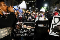 Black Lives Matter protesters march through Portland, Ore. after rallying at the Mark O. Hatfield United States Courthouse on Sunday, Aug. 2, 2020. Following an agreement between Democratic Gov. Kate Brown and the Trump administration to reduce federal officers in the city, nightly protests remained largely peaceful without major confrontations between demonstrators and officers. (AP Photo/Noah Berger)