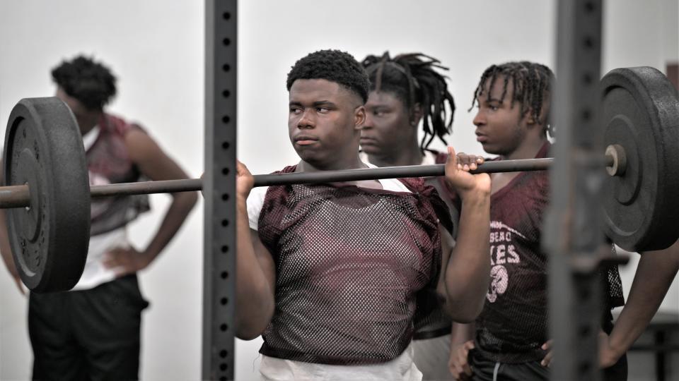 Palm Beach Lakes' Wilmesky Lafontant lifts in the gym during weight training after the on-field practice was paused because of lightning on Aug. 11, 2023.