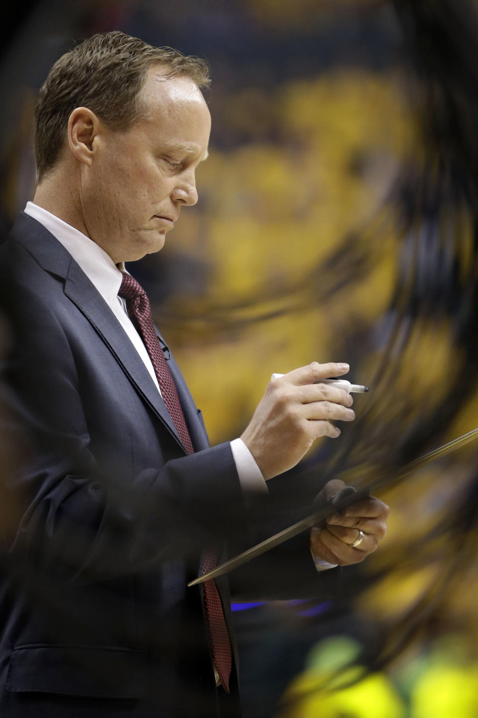 Atlanta Hawks head coach Mike Budenholzer writes on a whiteboard in the first half during Game 7 of a first-round NBA basketball playoff series against the Indiana Pacers in Indianapolis, Saturday, May 3, 2014. The Pacers won 92-80. (AP Photo/AJ Mast)