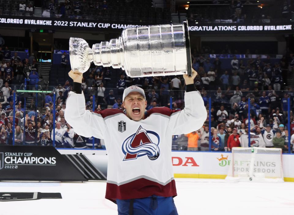 TAMPA, FLORIDA - JUNE 26: Jack Johnson #3 of the Colorado Avalanche carries the Stanley Cup following the series winning victory over the Tampa Bay Lightning in Game Six of the 2022 NHL Stanley Cup Final at Amalie Arena on June 26, 2022 in Tampa, Florida. (Photo by Bruce Bennett/Getty Images)