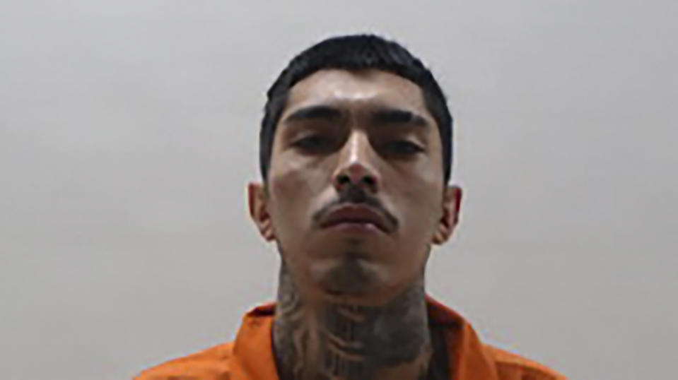 This booking photo provided by the Cameron County Sheriff's Department shows Rodrigo Axel Espinosa Valdez, 23, on Wednesday, Oct. 18, 2023. A South Texas police officer was fatally shot after he joined an hourslong pursuit of two men who fled a traffic stop and led officers on a chase through several cities before they were arrested, authorities said. The two suspects — Rogelio Martinez Jr. of Brownsville and Valdez of Mexico are facing multiple charges including capital murder, aggravated assault with a deadly weapon and evading arrest. (Cameron County Sheriff's Department via AP)