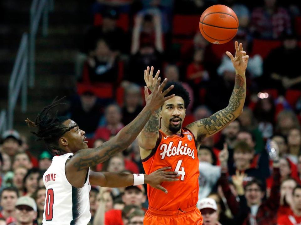 N.C. State’s DJ Horne pressures Virginia Tech’s Mekhi Long during the first half of the Wolfpack’s game on Saturday, Jan. 20, 2024, at PNC Arena in Raleigh, N.C.