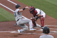 St. Louis Cardinals catcher Yadier Molina, right, attempts to tag out Miami Marlins right fielder Adam Duvall during the second inning of a baseball game Monday, June 14, 2021, in St. Louis. (AP Photo/Joe Puetz)