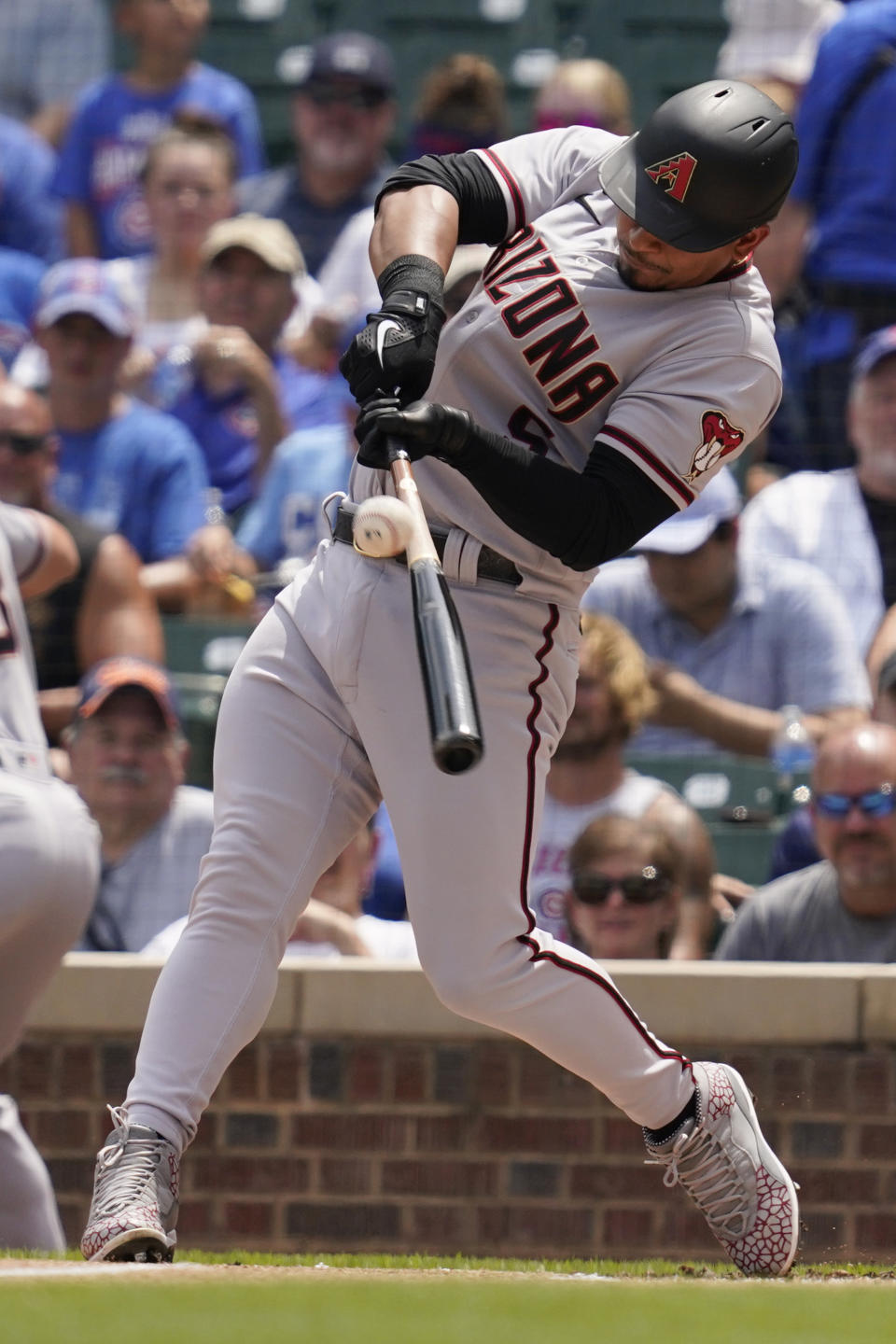 Arizona Diamondbacks' Eduardo Escobar hits a double during the first inning of a baseball game against the Chicago Cubs in Chicago, Saturday, July 24, 2021. (AP Photo/Nam Y. Huh)