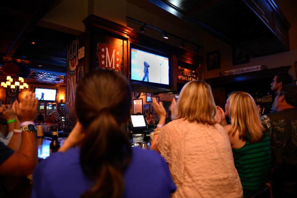 Customers in Mortimer’s Cafe and Pub in Epicentre cheer during President Barack Obama’s acceptance speech during the Democratic National Convention in Charlotte on Sept. 6, 2012.