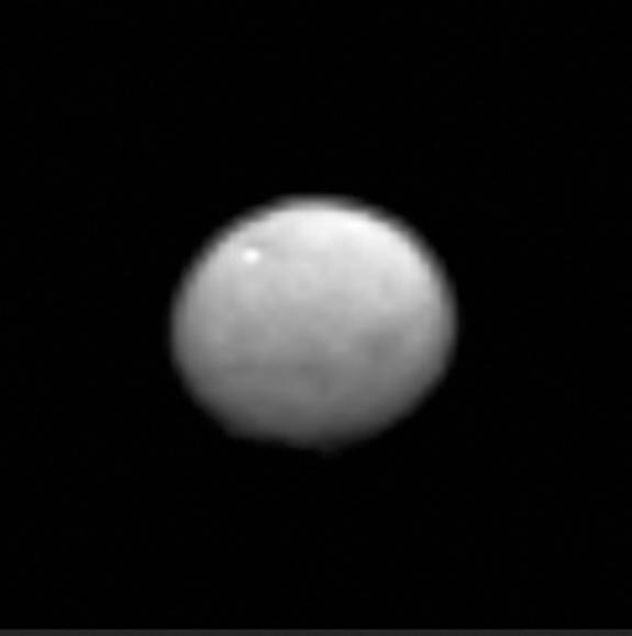 A zoomed-in view of the dwarf planet Ceres, seen from a distance of 238,000 miles (383,000 kilometers) by the Dawn spacecraft on Jan. 13, 2015. The image hints at the presence of craters and other features on Ceres' surface.