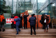 People stand outside the B.C. Supreme Court bail hearing of Huawei CFO Meng Wanzhou, who was held on an extradition warrant in Vancouver, British Columbia, Canada December 11, 2018. REUTERS/Lindsey Wasson