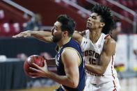 Boston College's Demarr Langford Jr. (15) defends against Notre Dame's Nikola Djogo during the first half of an NCAA college basketball game, Saturday, Feb. 27, 2021, in Boston. (AP Photo/Michael Dwyer)