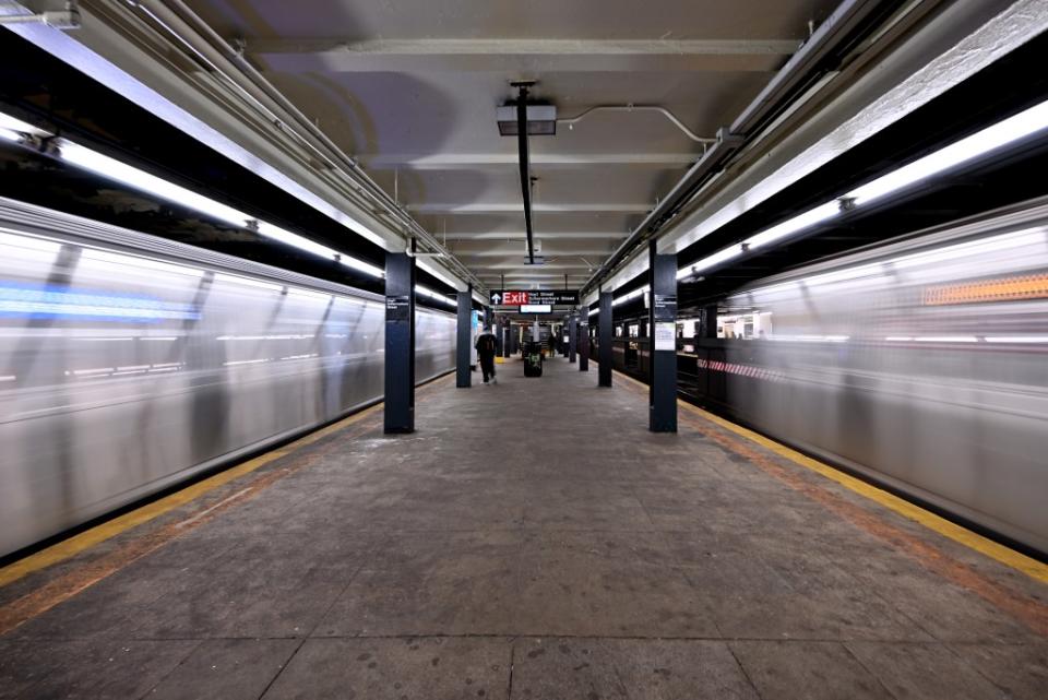 Trains arrive on both sides of a platform Paul Martinka