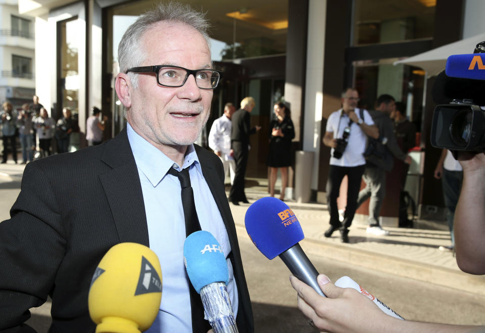 Cannes film festival director Thierry Fremaux speaks to journalists as he arrives at a hotel ahead of the 67th international film festival, Cannes, southern France, Tuesday, May 13, 2014. The festival runs from May 14th to May 25th. (AP Photo/Alastair Grant)