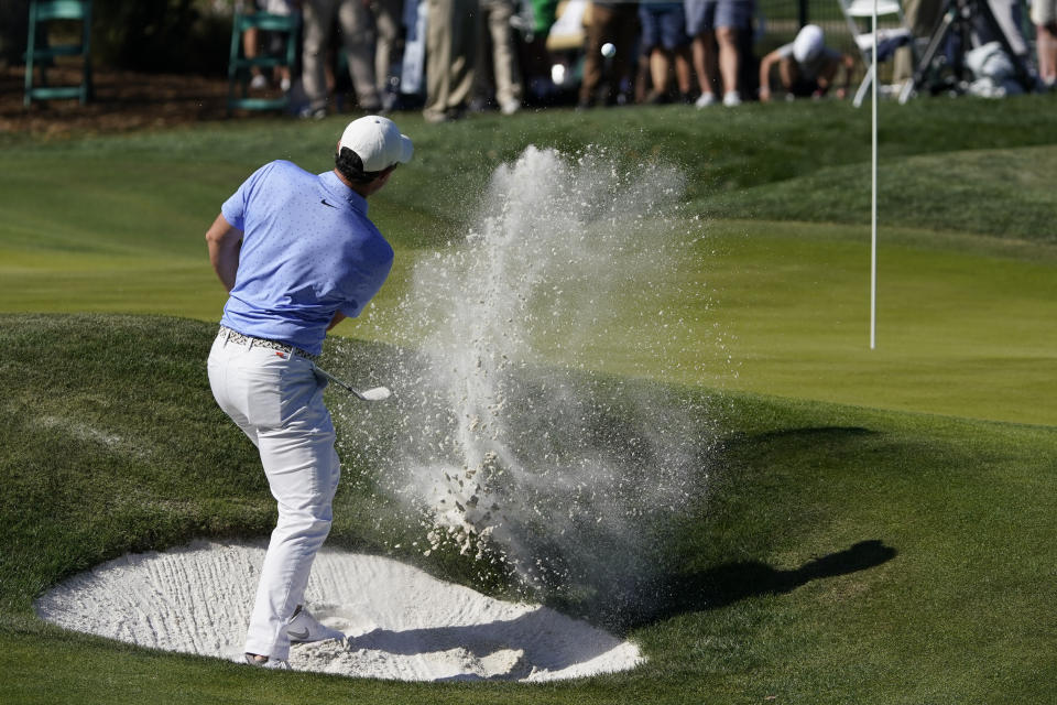 Rory McIlroy, of Northern Ireland, hits from the bunker on the ninth hole during the second round of the The Players Championship golf tournament Friday, March 12, 2021, in Ponte Vedra Beach, Fla. (AP Photo/John Raoux)